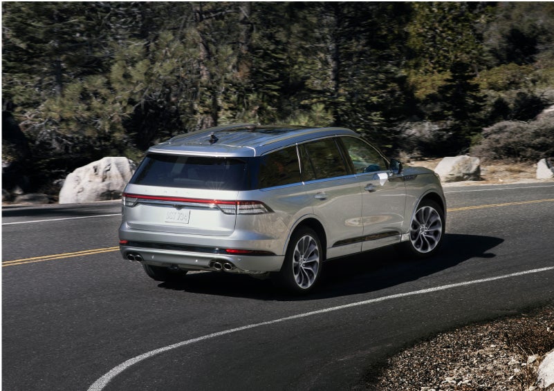 A Lincoln Aviator® is being driven on a winding road | Rydell Lincoln in Independence IA