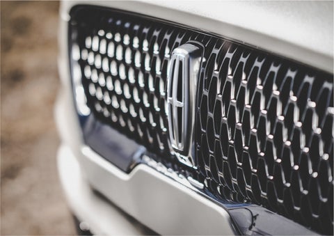 The grille of the 2023 Lincoln Aviator® Reserve model with an eye-catching repeated field of Lincoln Star logo shapes | Rydell Lincoln in Independence IA