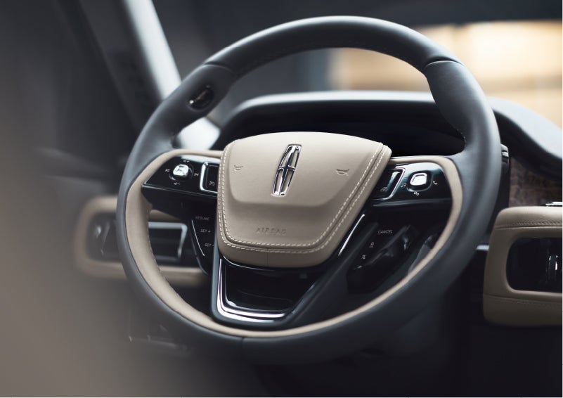 The intuitively placed controls of the steering wheel on a 2023 Lincoln Aviator® SUV | Rydell Lincoln in Independence IA