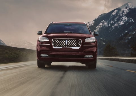 A 2024 Lincoln Aviator® SUV is shown in the Diamond Red exterior color. | Rydell Lincoln in Independence IA
