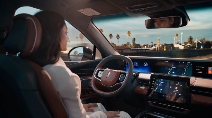 A person is shown driving hands-free on the highway with available Lincoln BlueCruise technology. | Rydell Lincoln in Independence IA